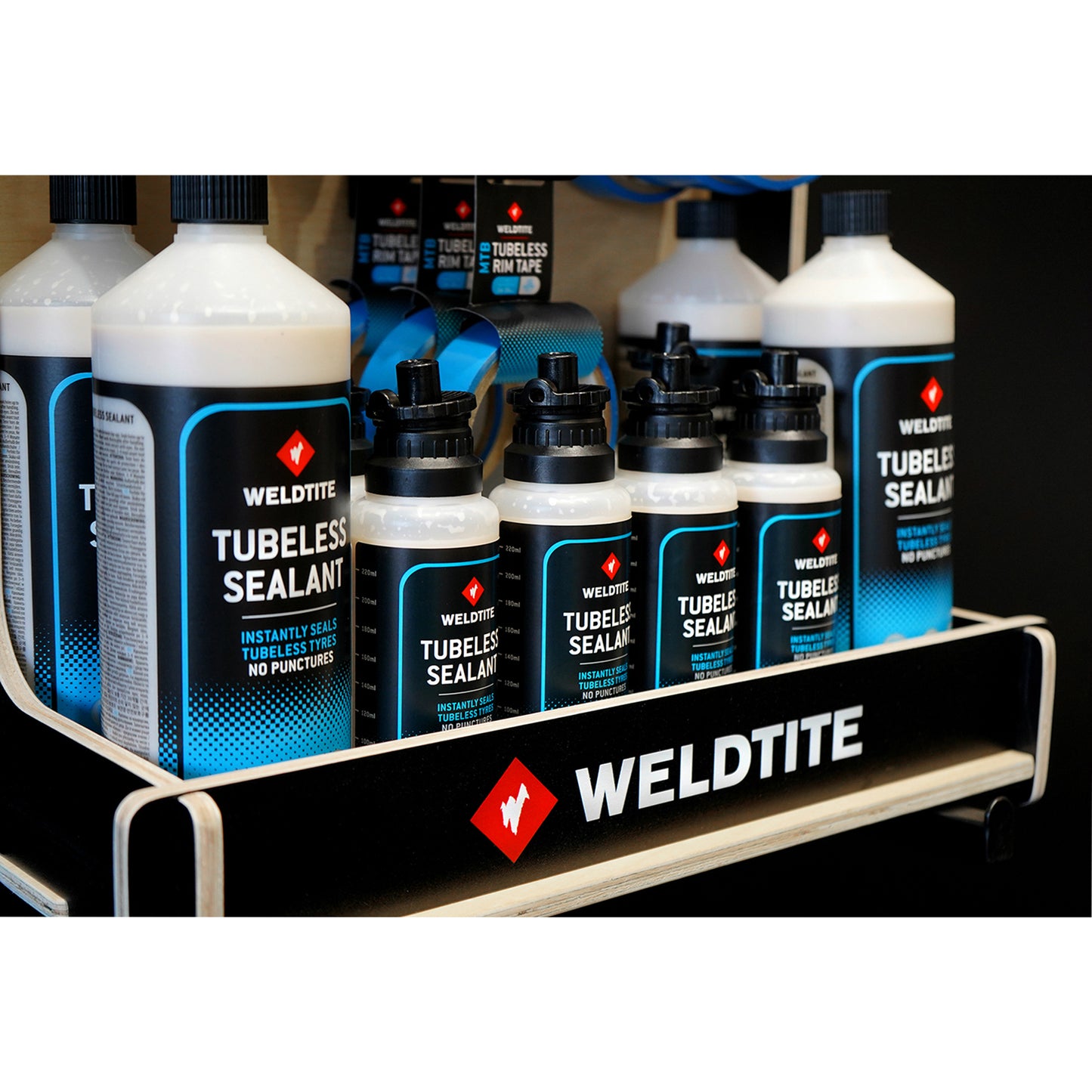 Complete Weldtite wood tubeless POS display (4x 1l tubeless sealant / 8x 240ml tubeless sealant / 12x 2 tubeless valve kits / 7x MTB tubeless rim tape / 4x road tubeless rim tape)